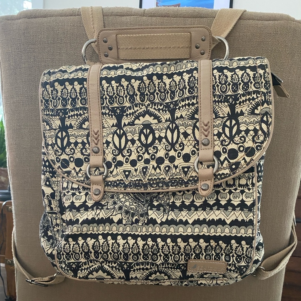 Cream and Black Backpack with Ornate Design and Rectangular Shape